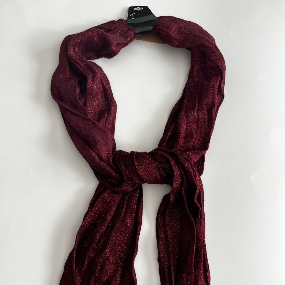 Red scarf with speckles.